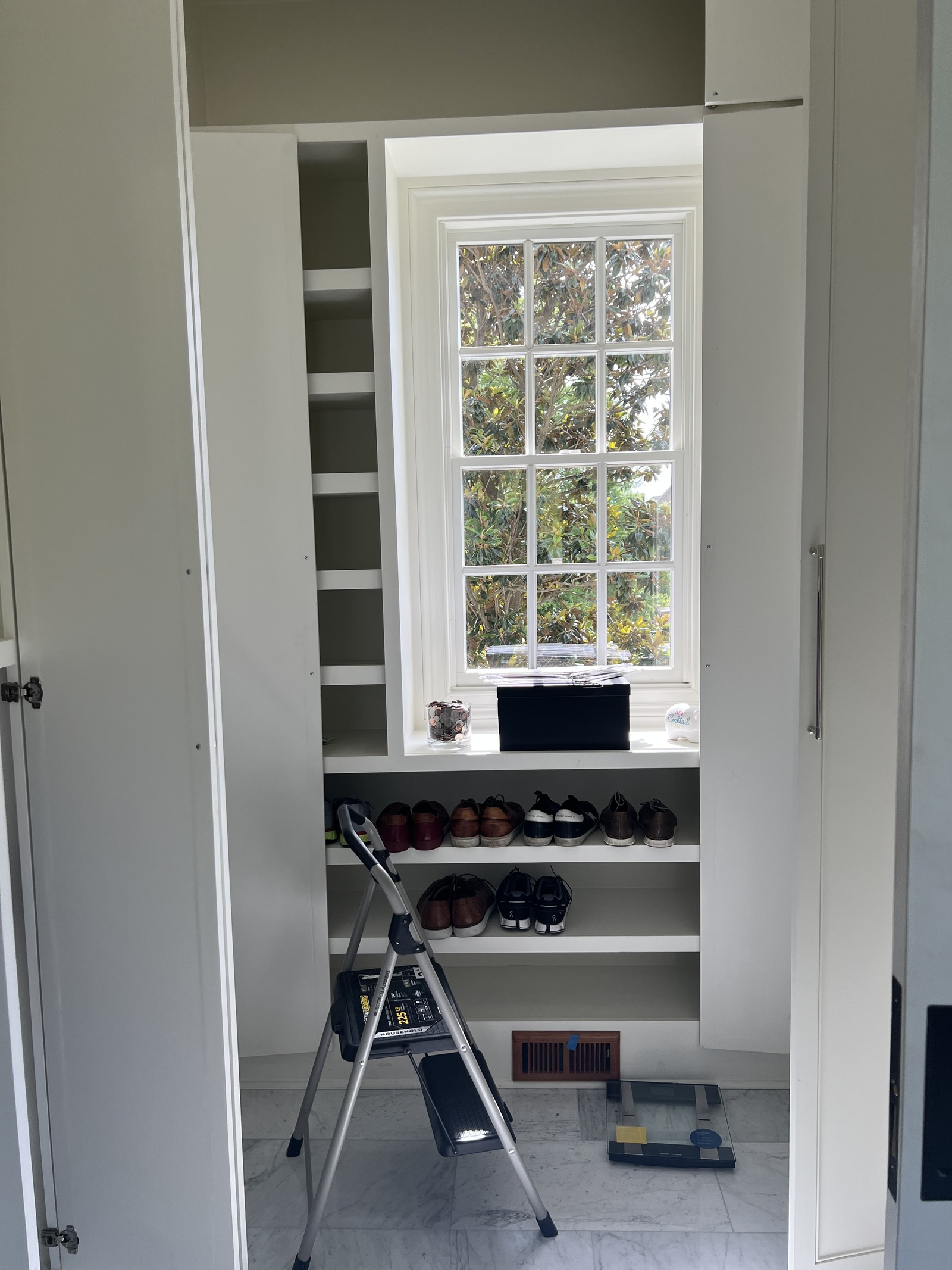 Franklin master closet before organizing, with clothing boxes and piles still waiting to be unpacked
