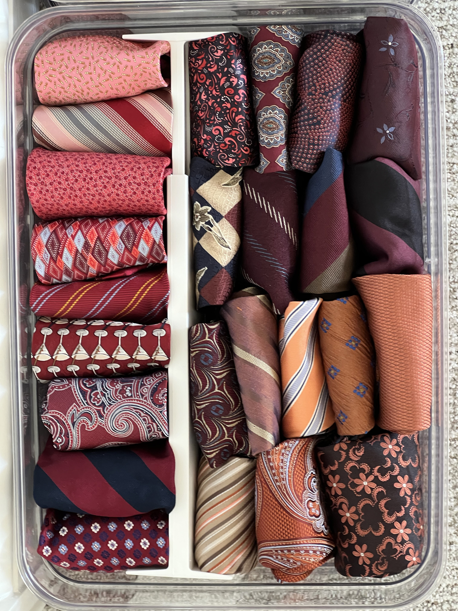 Professional menswear ties neatly folded in a drawer