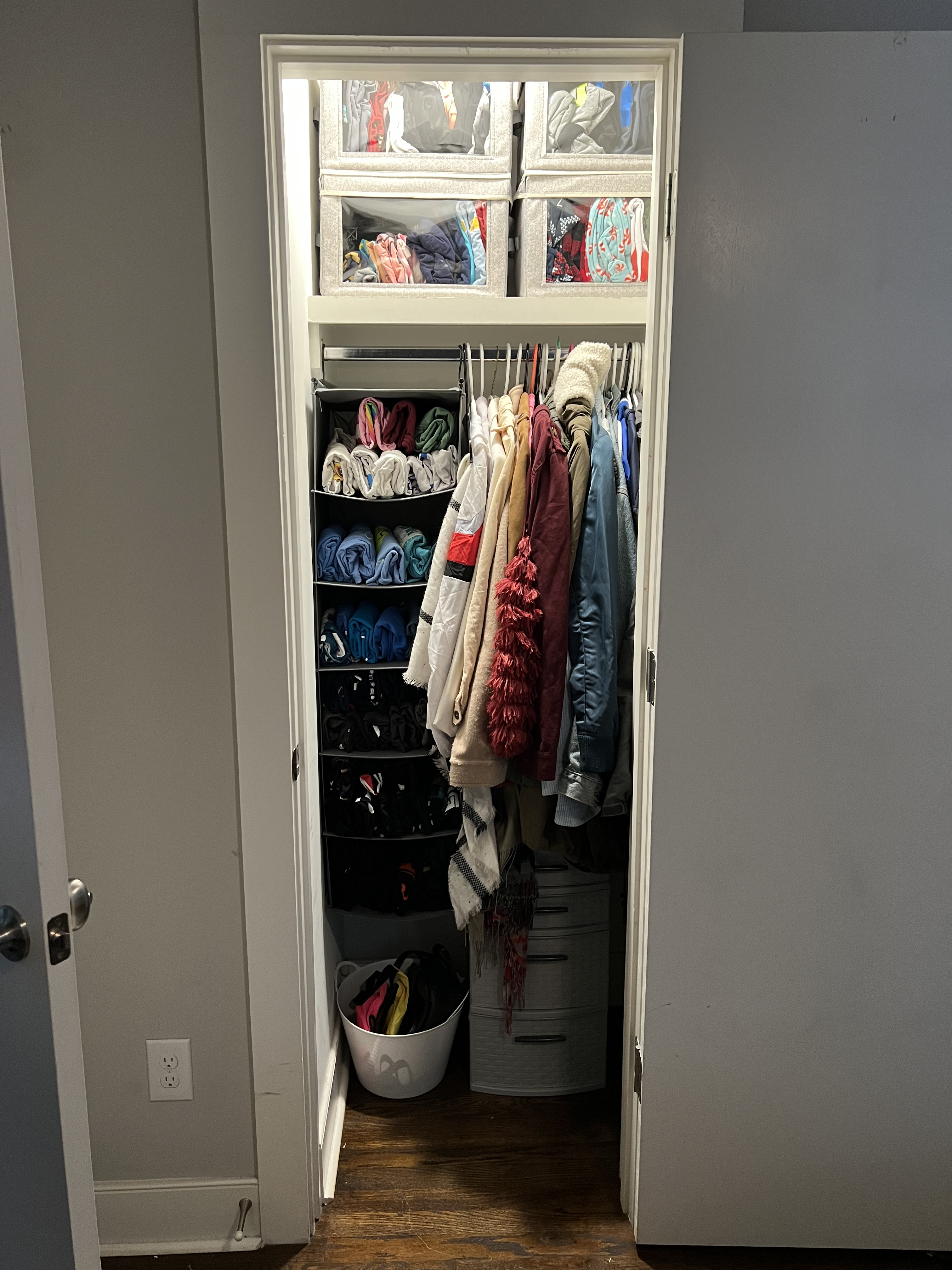 Closet after organizing session with neatly folded and hung clothes